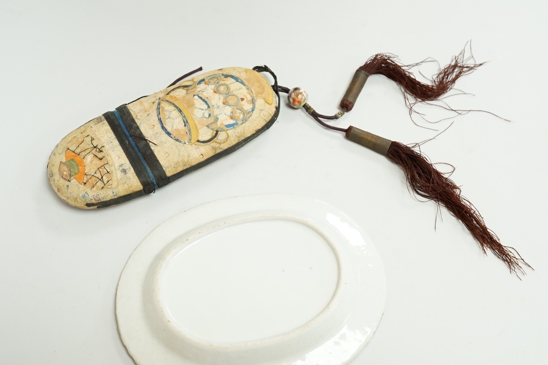 A Chinese embroidered spectacles case and an armorial oval miniature dish